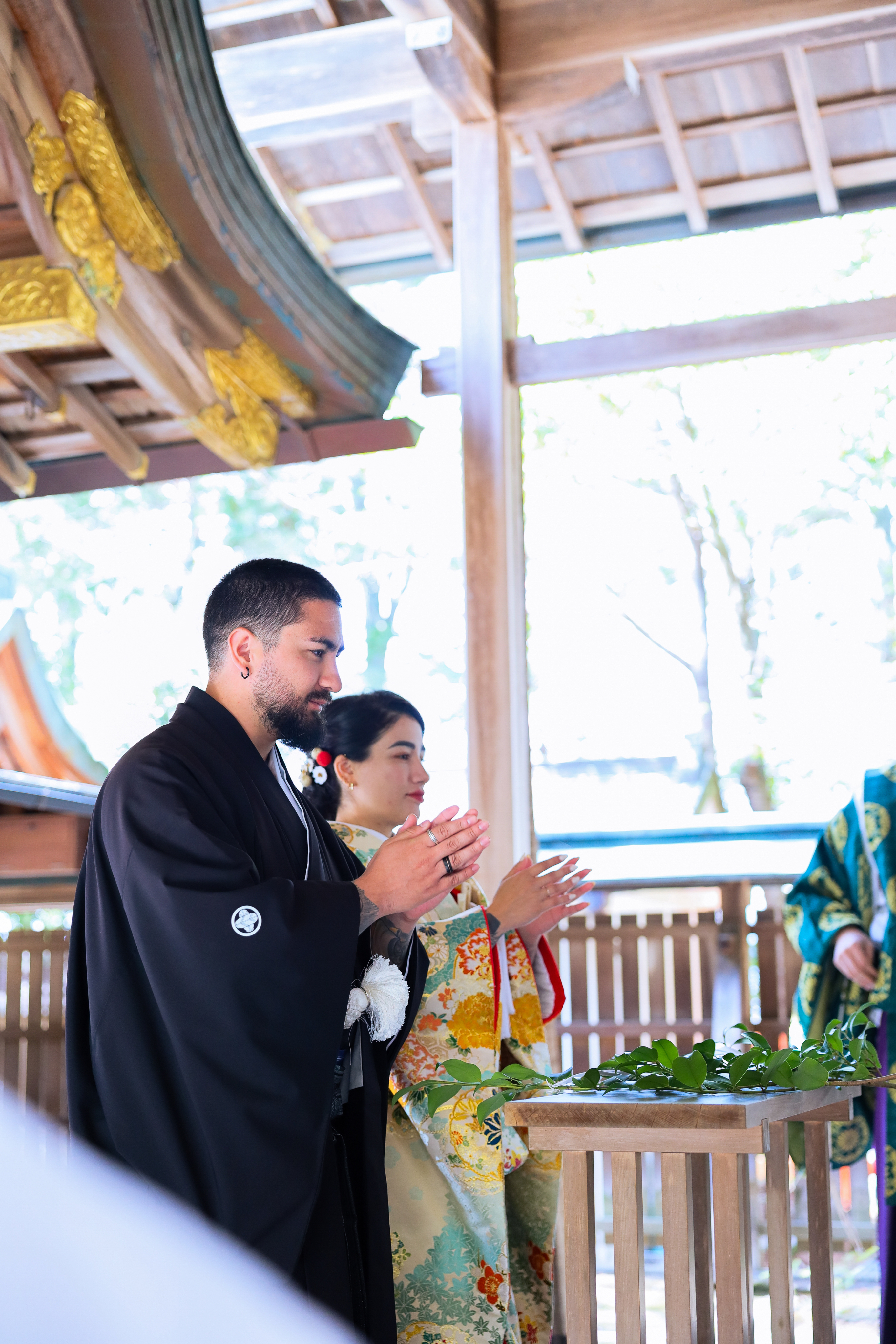 A dried flower rested upon wrinkled pieces of cloth paper.