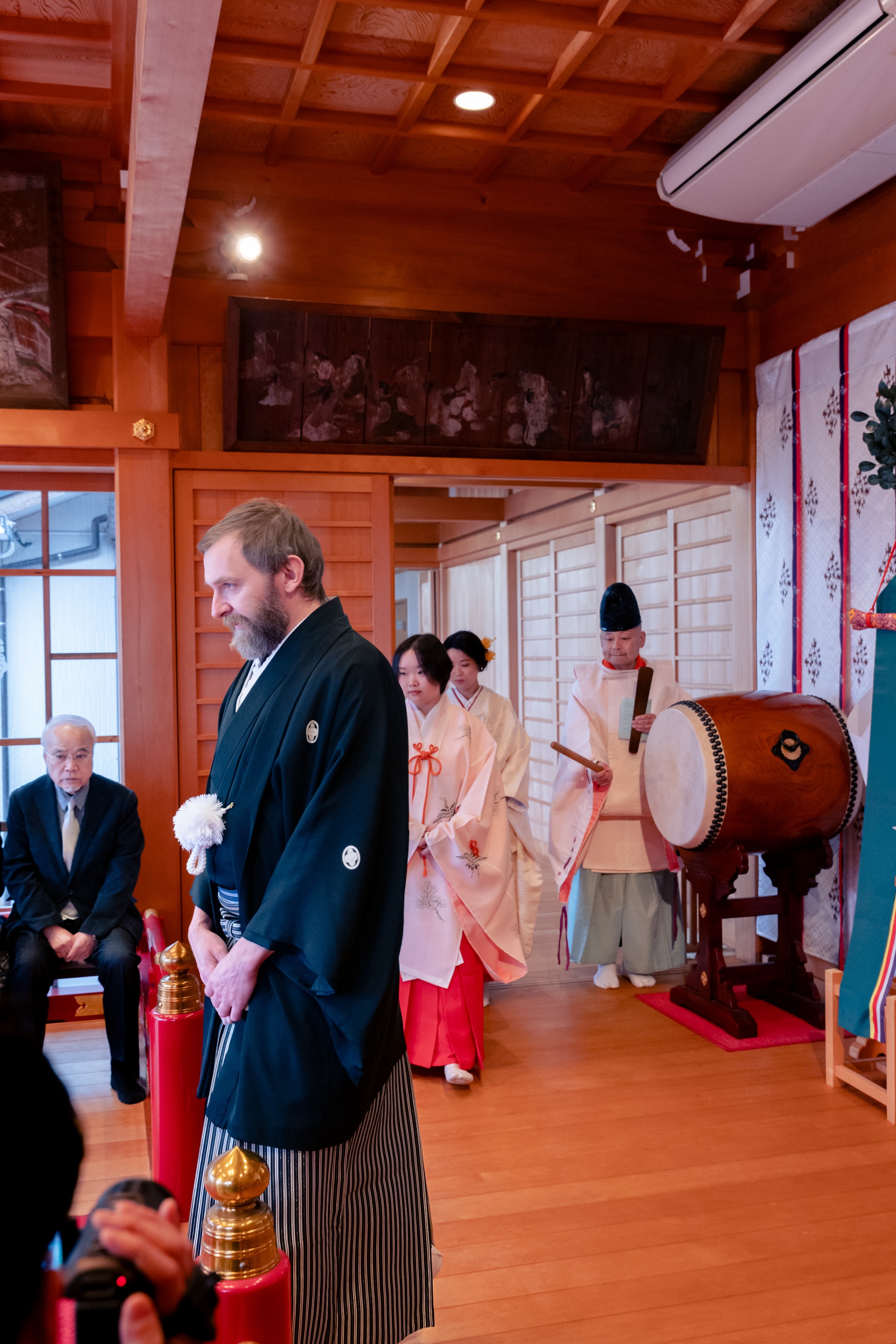 Cropped photo of the exterior of the top floor of an old stone building.