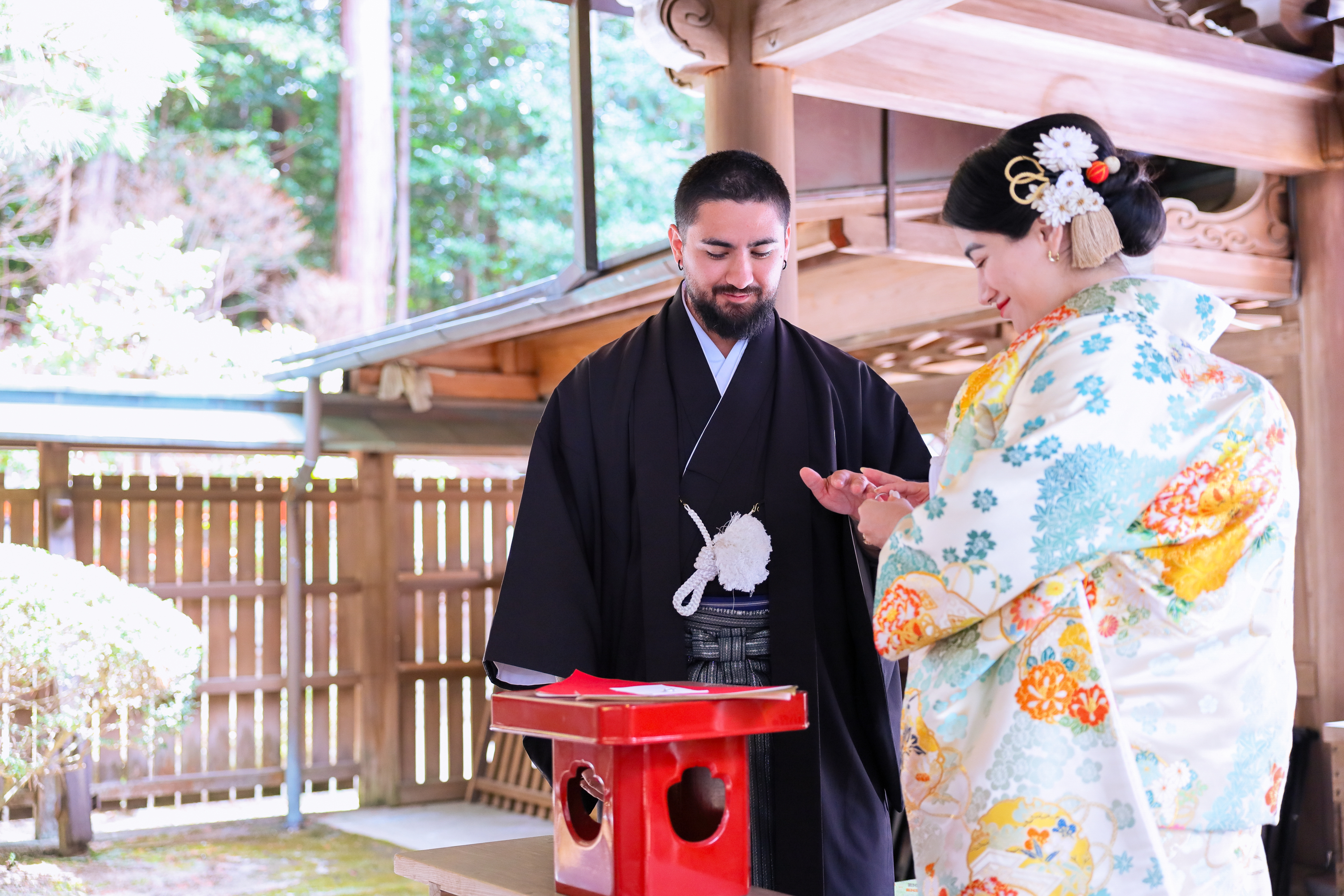 Delicate flowers taped to a wall.